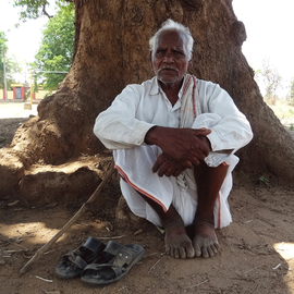 Mahadev Kamble sitting in a shade.