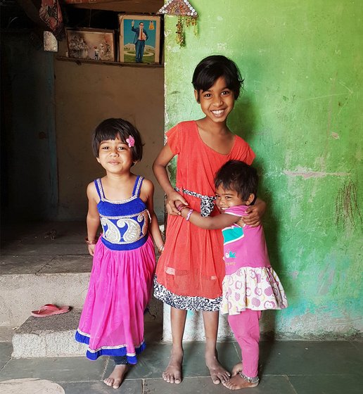 Three little girls standing, sisters