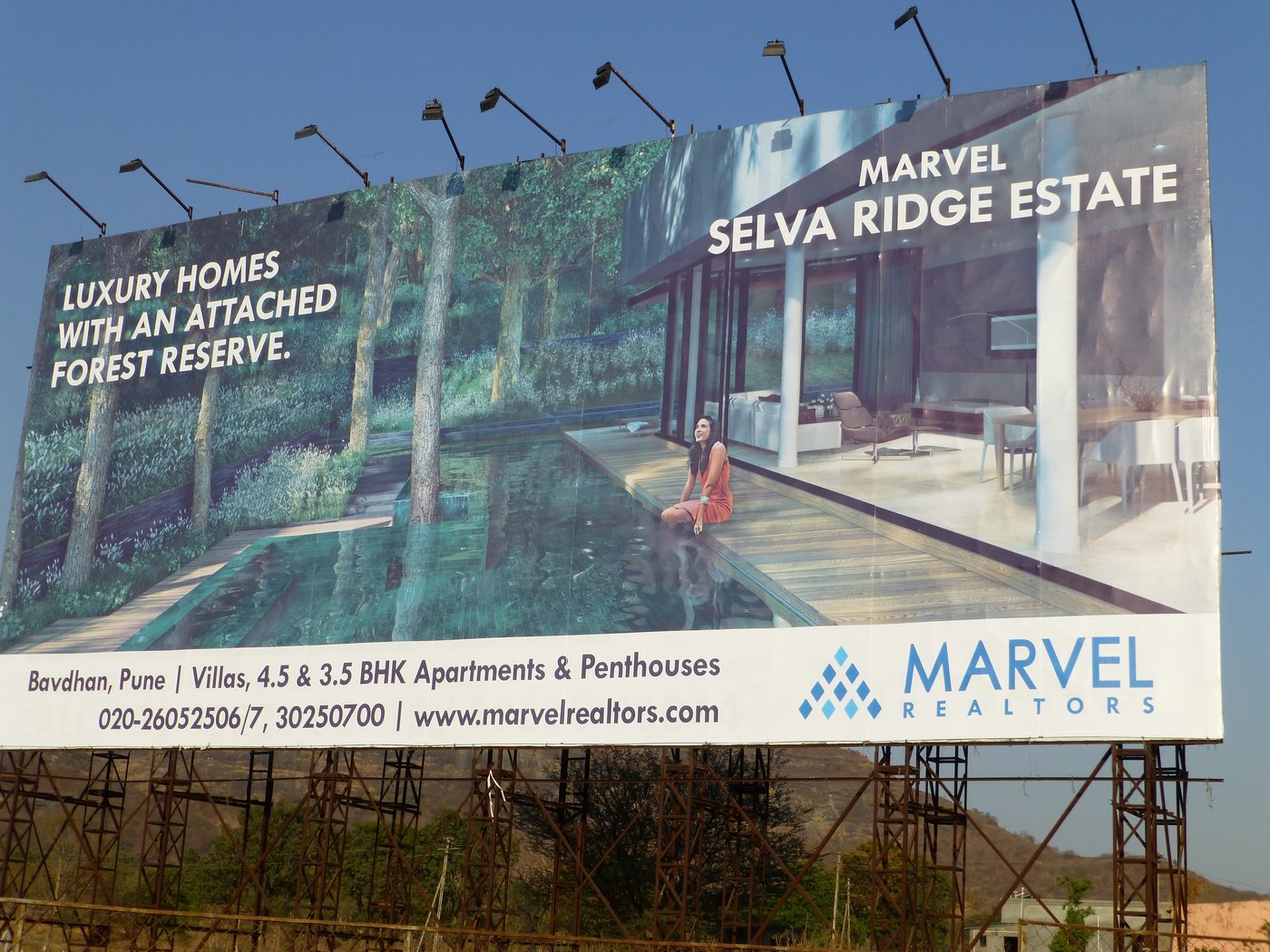 A hoarding advertising a realtor