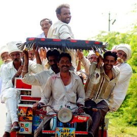 Group of men riding 'Chakkadda' - part motorcycle, part cart - of rural Saurashtra