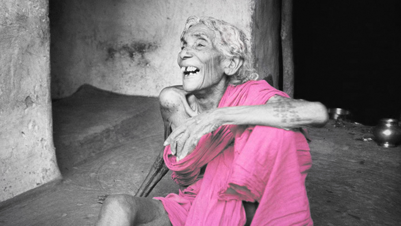 Old woman freedom fighter outside her home